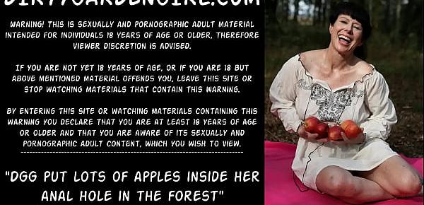  Dirtygardengirl put lots of apples inside her anal hole in the forest